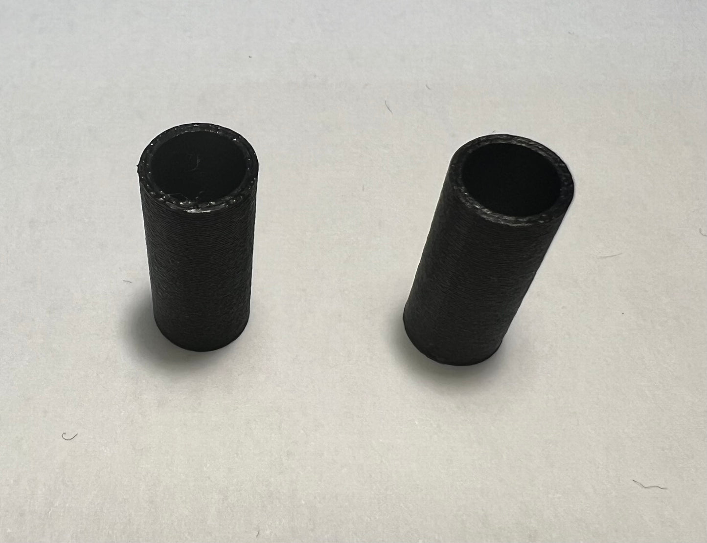 Offset bridge stud sleeves (makes bridge non-rocking)